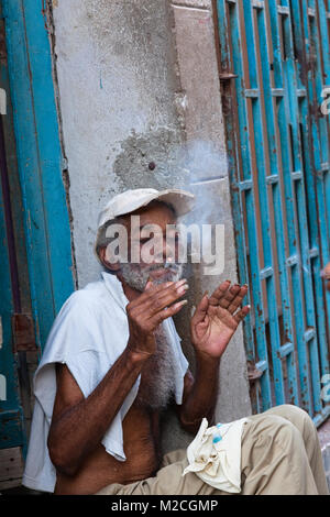A Cuban man smoking a cigarette in Havana, Cuba. Stock Photo