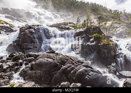 Summer mountain Langfossen waterfall on slope (Etne, Norway). Stock Photo