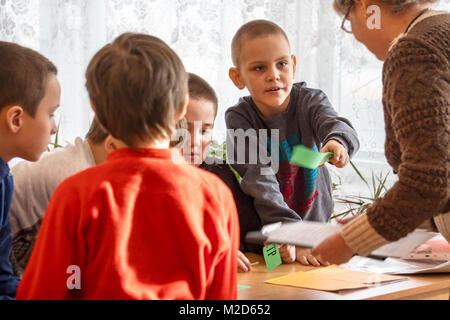 CHAPAEVSK, SAMARA REGION, RUSSIA - JANUARY 31, 2018: School kids of elementary school in the classroom with a female teacher Stock Photo