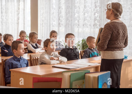 CHAPAEVSK, SAMARA REGION, RUSSIA - JANUARY 31, 2018: School kids of elementary school in the classroom with a female teacher Stock Photo