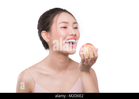 Smiling woman with healthy teeth holding green apple Stock Photo