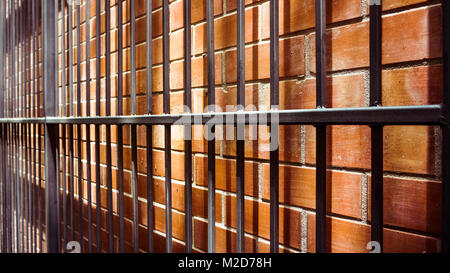 Old metal  on brick wall Stock Photo