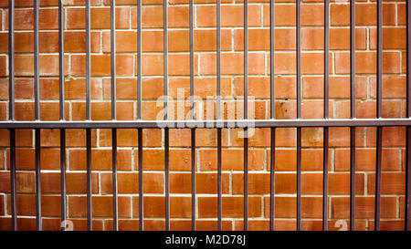 Old metal  on brick wall Stock Photo