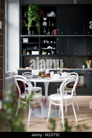 3D Rendering house indoors kitchen room no people dining table with meal served cozy modern style Stock Photo