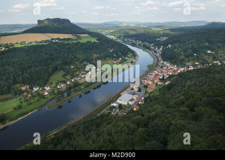 The village of Königstein on the Elbe River pictured from the Königstein Fortress (Festung Königstein) in Saxon Switzerland (Sächsische Schweiz) in Saxony, Germany. Mount Lilienstein (415 m) is seen in the background. Stock Photo