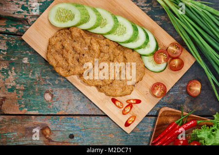 Vietnam fried fish patty with vegetable and sauce. Stock Photo