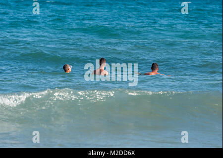 Father with sons are swimming in The  Mediterranean Sea, Spain. Stock Photo