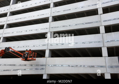 workers in a bucket lift, construction site, Miami, Florida Stock Photo