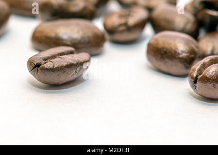Closeup of roasted coffee beans on white background Stock Photo