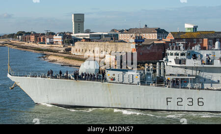 Comedian & TV Presenter Rhod Gilbert, is visible talking to crew members beside the gun turret on HMS Montrose as it leaves Portsmouth, UK on 5/2/18. Stock Photo