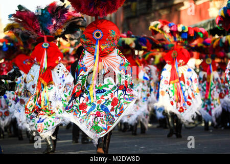 Horizontal photo of a Carnival scene, dancers wearing a traditional mexican folk with an amazing cape rich in color Stock Photo
