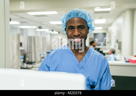 Portrait of smiling Black doctor in hospital Stock Photo