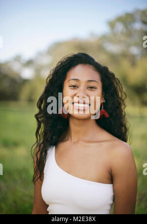 Portrait of smiling mixed race woman Stock Photo