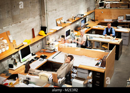 Business people working in busy office Stock Photo