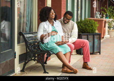 Portrait of a happy pregnant African American couple. Stock Photo