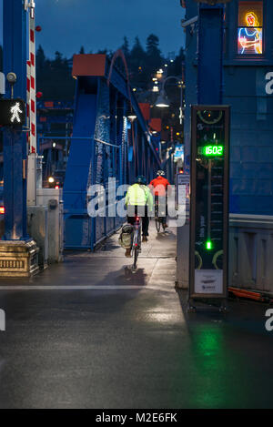 United States, Washington, Seattle, Bicyclists crossing the Fremont Bridge across the Ship Canal Stock Photo