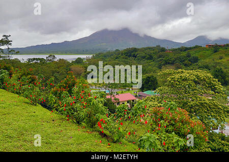View towards Arenal Volcano and the Laguna Arenal and National Park from the remote village of El Castillo in Northern Costa Rica. Stock Photo