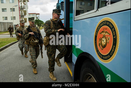 U.S. Marines with Headquarters and Service Company, 3rd Battalion, 3rd Marine Regiment, 3rd Marine Division, get into buses that will take them to White Beach in Okinawa, Japan, Feb. 1, 2018. The Marines are preparing to embark on the amphibious assault ship USS Bonhomme Richard (LHD-6), an going to Thailand to participate in Exercise Cobra Gold 2018. Cobra Gold 18 is an annual exercise conducted in the Kingdom of Thailand and runs from Feb. 13-23 with seven full participating nations. (U.S. Marine Corps Stock Photo