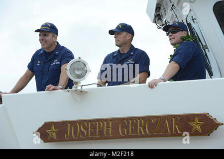 Capt. Michael Long, Coast Guard Sector Honolulu commander and Captain of the Port for the Port of Honolulu stands with Cmdr. Riley Gatewood, enforcement branch chief for the Coast Guard 14th District and Lt. Colin McKee, commanding officer of the Guard Cutter Joseph Gerczak (WPC 1126), during the Joseph Gerczak’s arrival to Coast Guard Base Honolulu, Feb. 4, 2018. The Joseph Gerczak is the second of three 154-foot fast response cutters stationed in Hawaii. (U.S. Coast Guard Stock Photo