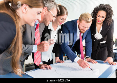 Group of business people analyzing data Stock Photo