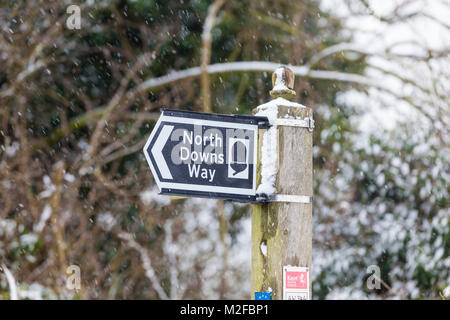 North downs way signpost covered in snow Stock Photo