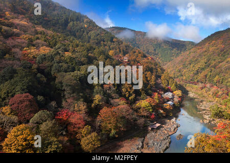 Katsura River and village closed to river, Arashiyama in beautiful autumn season, Kyoto, Japan. Stock Photo