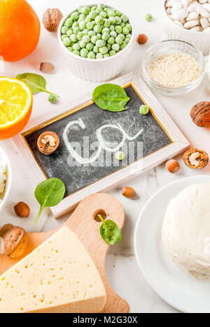 Healthy food concept. Set of food rich in calcium - dairy and vegan Ca products, white marble background Stock Photo