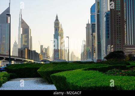 DUBAI, UNITED ARAB EMIRATES - FEBRUARY 5, 2018: Dubai downtown view from the pedestrian walkway with Downtown Dubai skyscrapers at sunset Stock Photo