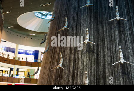 DUBAI, UNITED ARAB EMIRATES - FEBRUARY 5, 2018: Water wall in Dubai mall known as Human Waterfalls where the cascading water occupies the height of th