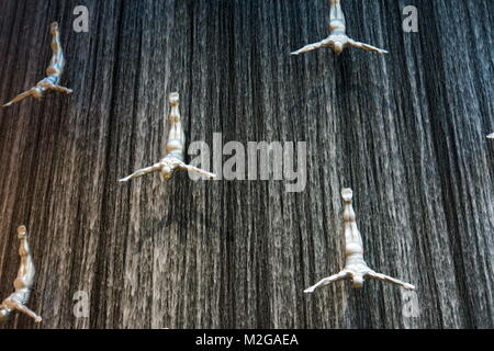 DUBAI, UNITED ARAB EMIRATES - FEBRUARY 5, 2018: Water wall in Dubai mall known as Human Waterfalls where the cascading water occupies the height of th