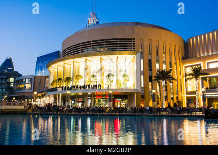 DUBAI, UNITED ARAB EMIRATES - FEBRUARY 5, 2018: Dubai mall modern architecture reflected in the fountain at blue hour. The Dubai Mall is the largest m Stock Photo