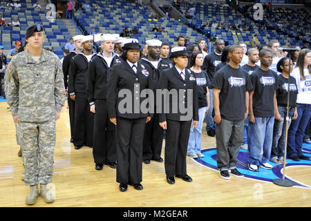 New Orleans - Louisiana National Guard recruits participate in a swearing in ceremony prior to New Orleans Hornets game on Mar. 12. The ceremony took place during the Hornets military appreciation night festivities in the New Orleans Arena.    (U.S. Air Force MSgt Toby M Valadie Louisiana National Guard State Public Affairs Office/Released) Swear In at Hornets Game 100312-F-2117V-043 by Louisiana National Guard Stock Photo