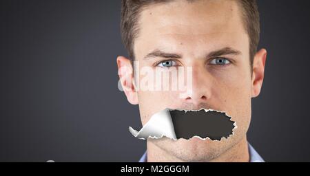 Man with torn paper on mouth Stock Photo