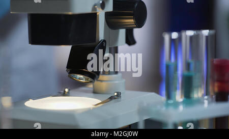 Closeup of clean working surface of microscope ready for medical test, equipment, stock video Stock Photo