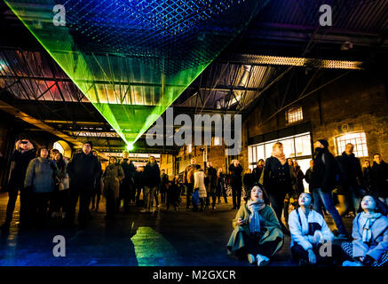 Crowds enjoy Aether by the Architecture Social Club with Max Cooper - an installation within the Kings Cross Area of Lumiere London 2018 on Friday January 19 2018 Stock Photo