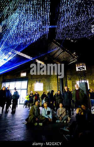 Crowds enjoy Aether by the Architecture Social Club with Max Cooper - an installation within the Kings Cross Area of Lumiere London 2018 on Friday January 19 2018 Stock Photo