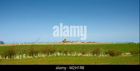 Bulldozer working on a landfill site in the East Riding of Yorkshire, England, UK, GB. Stock Photo