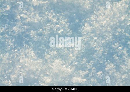 abstract blue white background of snow close up. winter snowflakes snowy view Stock Photo