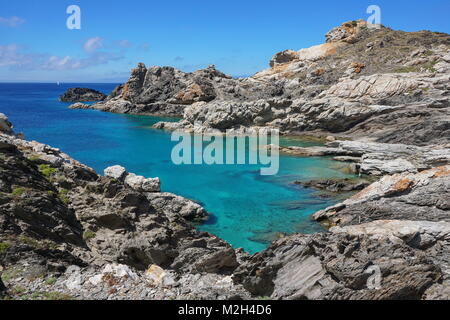 Rocky shore with clear water in the natural park of Cap de Creus, Mediterranean sea, Spain, Costa Brava, Alt Emporda, Catalonia Stock Photo