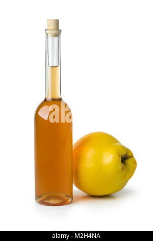 Glass bottle of homemade quince liqueur isolated on white background Stock Photo