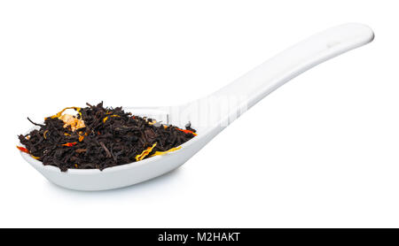 fruit-floral dry tea in spoon on white isolated background Stock Photo