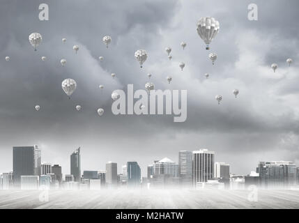 Concept of air pollution concept with aerostats flying above city Stock ...