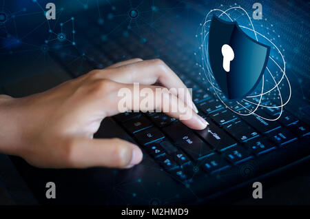 Press enter button on the keyboard computer Shield cyber Key lock security system abstract technology world digital link cyber security on hi tech Dar Stock Photo