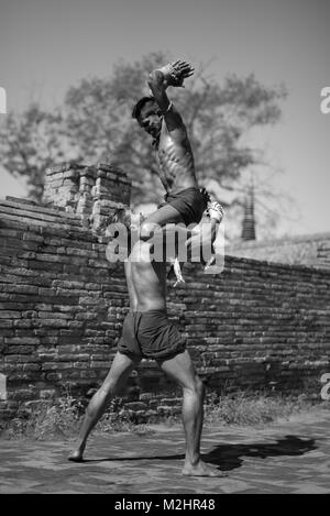 AYUTTHAYA, THAILAND - DECEMBER 17: Two ancient fighter  that known as Muay Thai are fighting in the archaeological site on December 17, 2017 in Ayutth Stock Photo