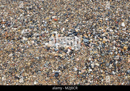 Perfect sea colored pebbles on the European Spanish coast of the Atlantic Ocean. Abstract background for tourist brochures Stock Photo