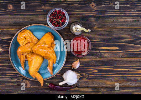 Plate with smoked chicken wings Stock Photo