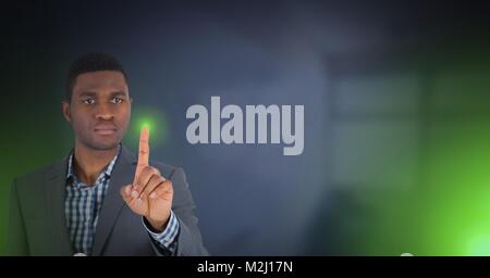 Man's Hand touching green light Stock Photo