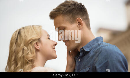 Couple in love looking at each other, romantic date, tender feelings, close-up, stock video Stock Photo