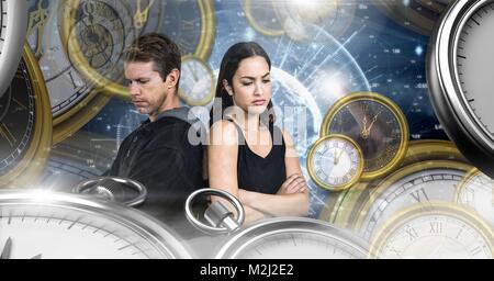 Couple in surreal time and space with clocks Stock Photo