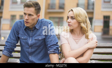 Jealous girl having fight with upset boyfriend, conflict of unhappy people, stock video Stock Photo